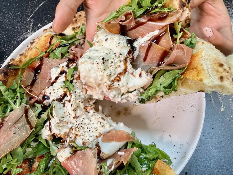 Freshly baked Burrata & Prosciutto Pizza made from a 70% hydration pizza dough recipe showing a beautifully airy crust.
