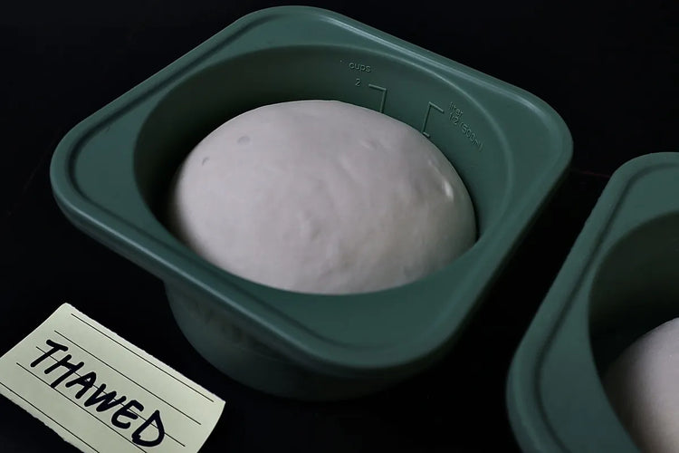 Thawed 230 gram pizza dough ball after an overnight refrigerator thaw and room-temperature rest